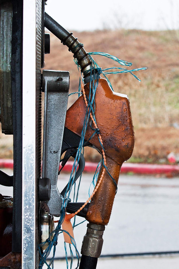 Red fuel pump to illustrate fuel shipping surcharges.