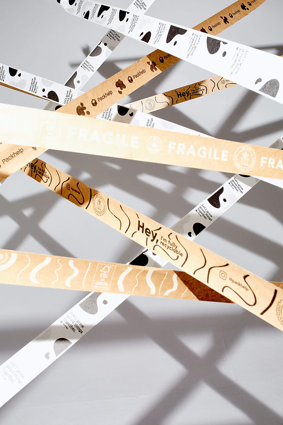 Strips of brown and white branded shipping tape crossing each other horizontally.